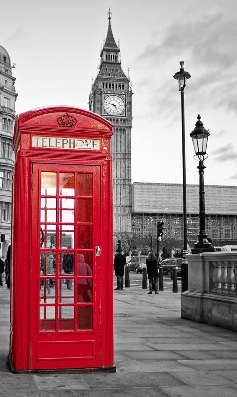Telephone booth,Red,Payphone,Telephony,Building,Telephone,Architecture,Outdoor structure,City,Facade,Black-and-white,Door
